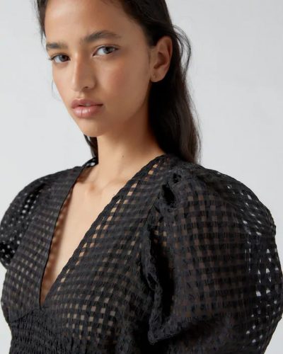 Contemporary Black Eyelet Blouse with Puff Sleeves and Bow Detail