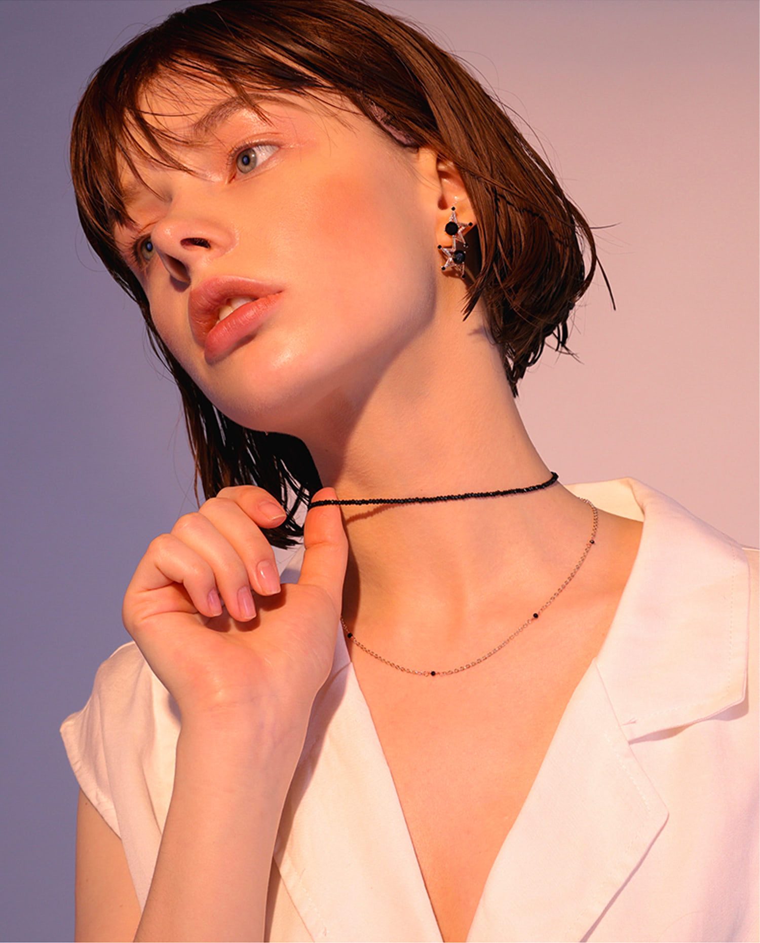 Contemporary V-Neck White Blazer with Elegant Chain Accessories